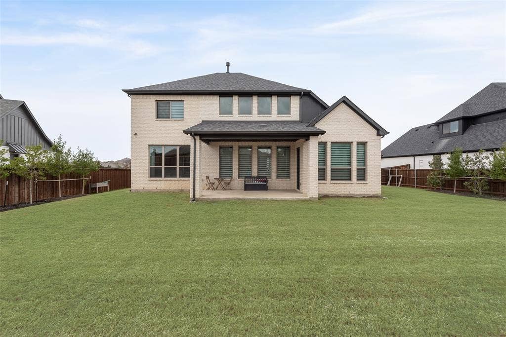 7108 Woodside Drive, Argyle, TX 76226 Private backyard with eagleston holly trees, magnolia trees along the fence