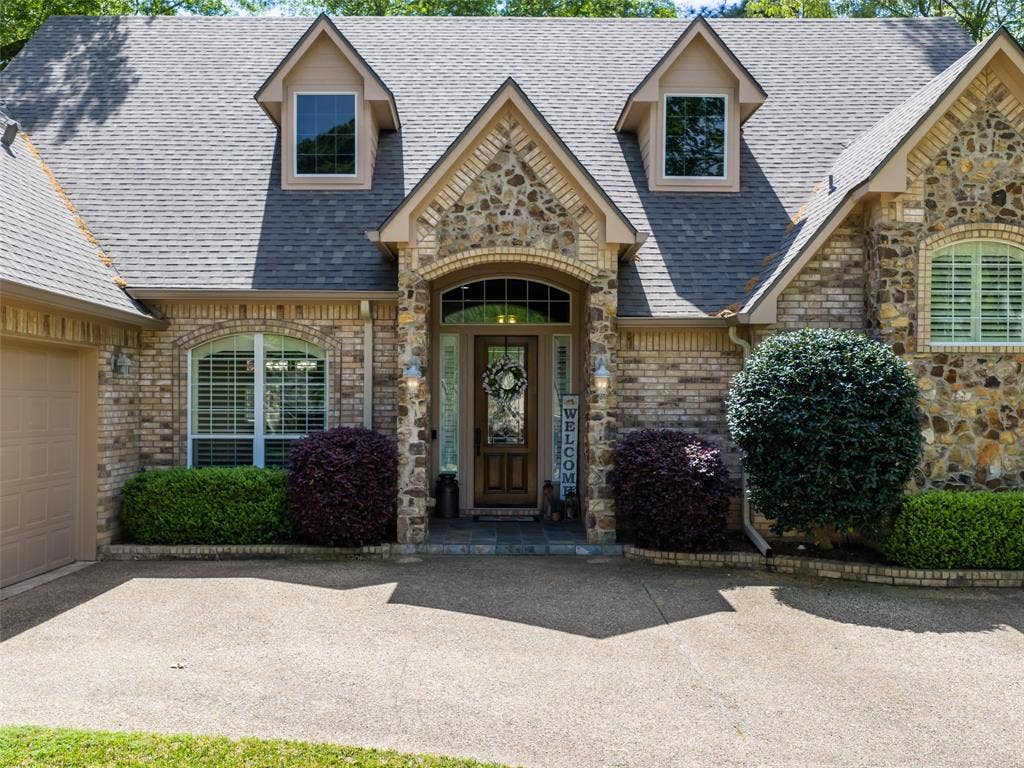 1137 Ashwood Drive, Tyler, TX 75703 Beveled glass and wood front door welcome you into this amazing and well manicured home.