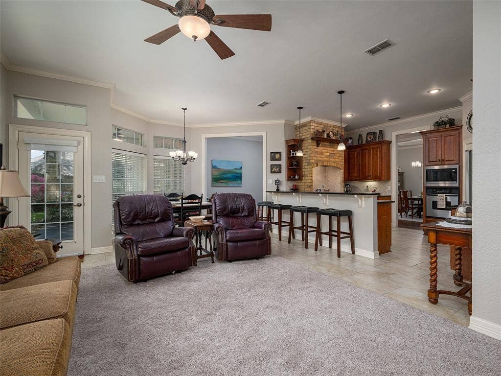 1137 Ashwood Drive, Tyler, TX 75703 View of den open to kitchen area with space for bar seating at the counter.