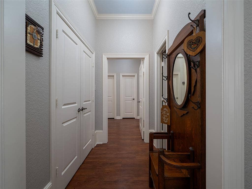 1137 Ashwood Drive, Tyler, TX 75703 Hallway leading to the Primary suite with 2 closets and an outdoor hallway door for privacy.