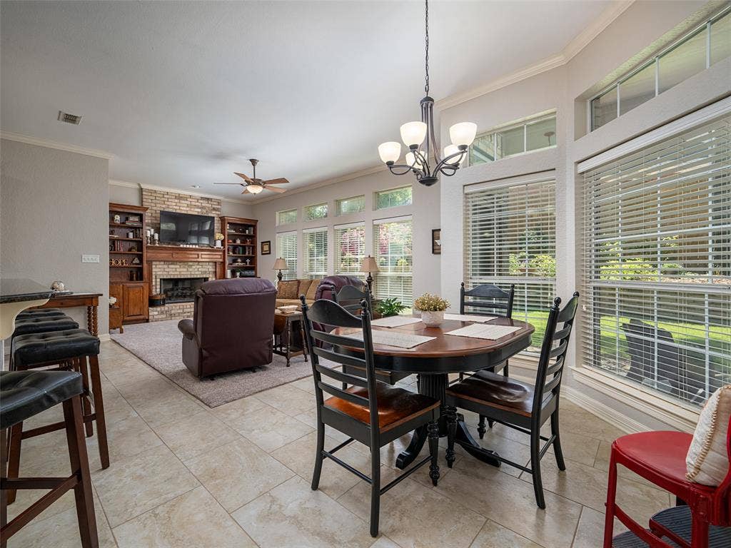 1137 Ashwood Drive, Tyler, TX 75703 Tons of light enters into this cheerful, and open floor plan featuring the den, kitchen and eating area. Notice the transom windows for added beauty.