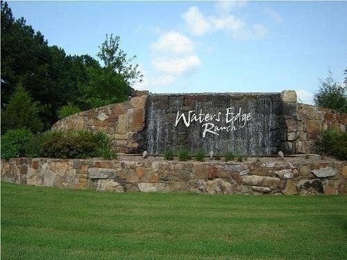 302/303 Lago Vista Drive, Athens, TX 75752 Community / neighborhood sign featuring a lawn