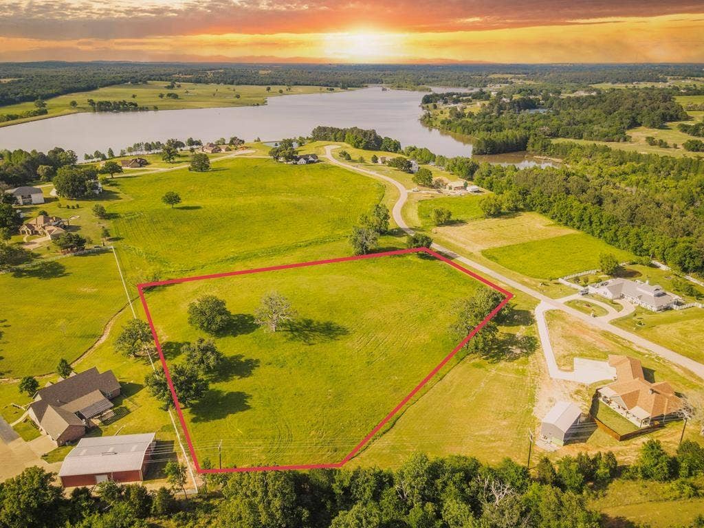 302/303 Lago Vista Drive, Athens, TX 75752 Aerial view at dusk with a water view