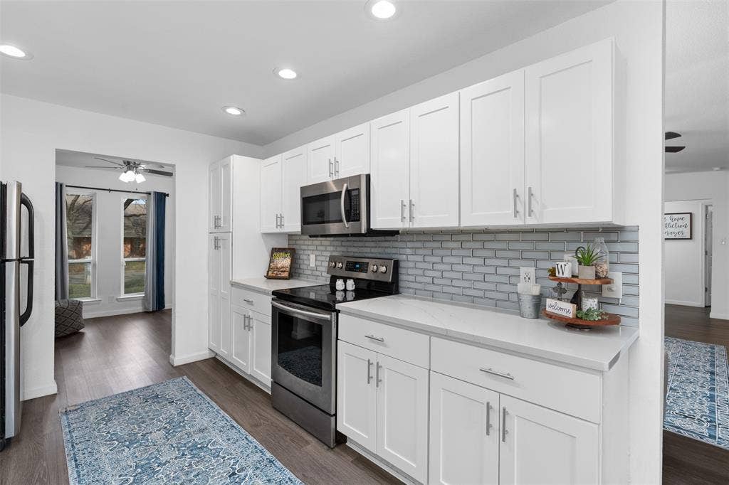 1819 W Cedar Elm Drive, Arlington, TX 76012 Recently updated with quartz counters and sleek tile backsplash!