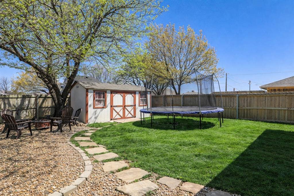 317 Stillmeadow Drive, Garland, TX 75040 Step outside and discover a space designed for both relaxation and gathering. Mature trees provide shade and character, while the open yard offers room to unwind, entertain, or simply enjoy the outdoors at your own pace.