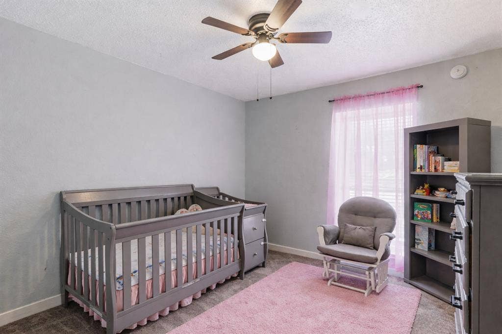 317 Stillmeadow Drive, Garland, TX 75040 Soft natural light and calming tones create a peaceful atmosphere in this inviting space. Perfect for a bedroom, nursery, or quiet workspace, it offers flexibility to fit your lifestyle as it evolves.