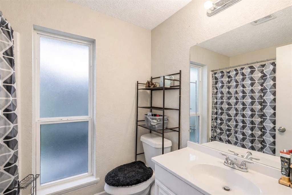 317 Stillmeadow Drive, Garland, TX 75040 Bright and functional with a clean, neutral design, this bathroom offers a practical layout and plenty of space for everyday routines. A simple, refreshed feel that’s ready to go from day one.