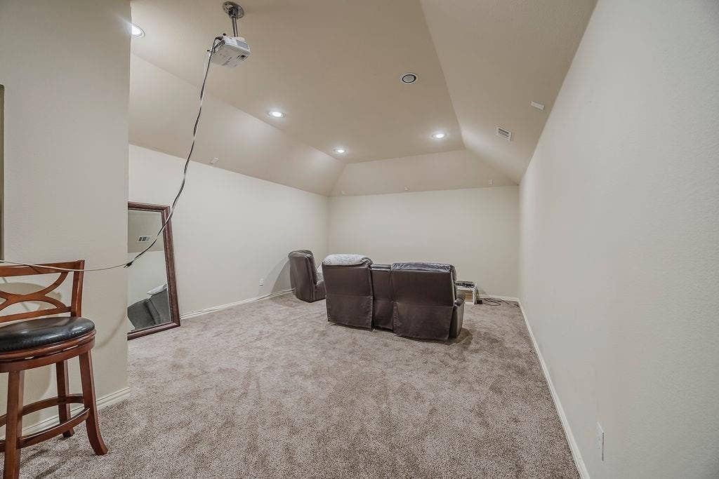 1011 Parview Circle, Grand Prairie, TX 75104 Home theater room featuring recessed lighting, lofted ceiling, and light carpet