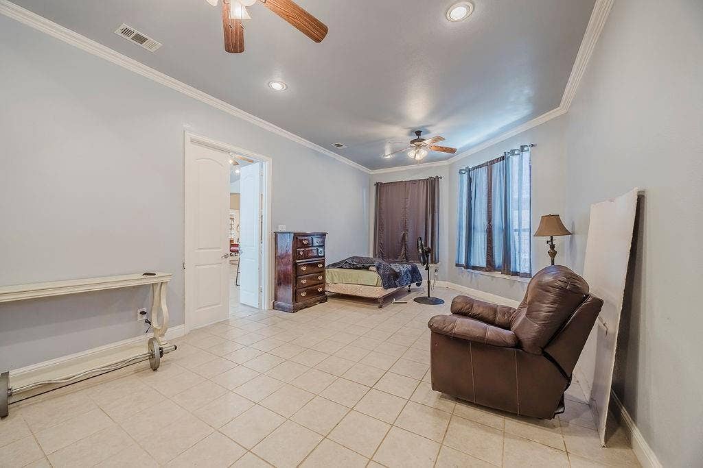 1011 Parview Circle, Grand Prairie, TX 75104 Living area with ceiling fan, ornamental molding, light tile patterned floors, and recessed lighting
