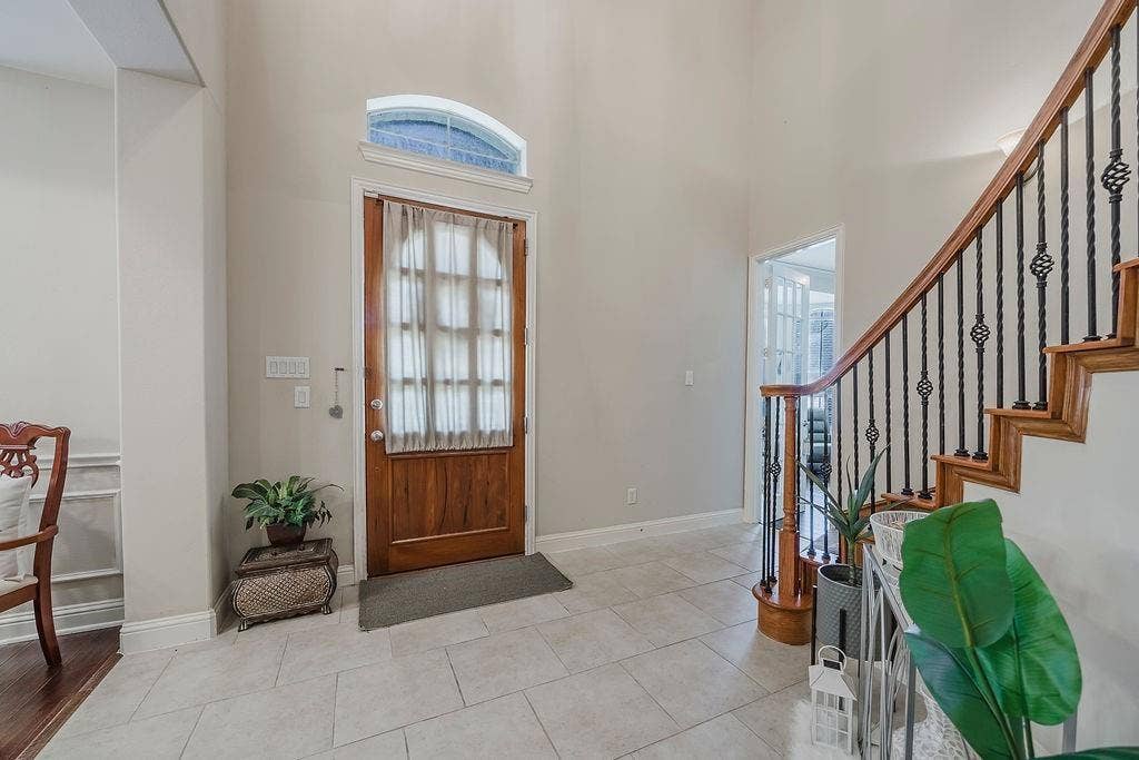 1011 Parview Circle, Grand Prairie, TX 75104 Entrance foyer featuring a high ceiling and light tile patterned floors