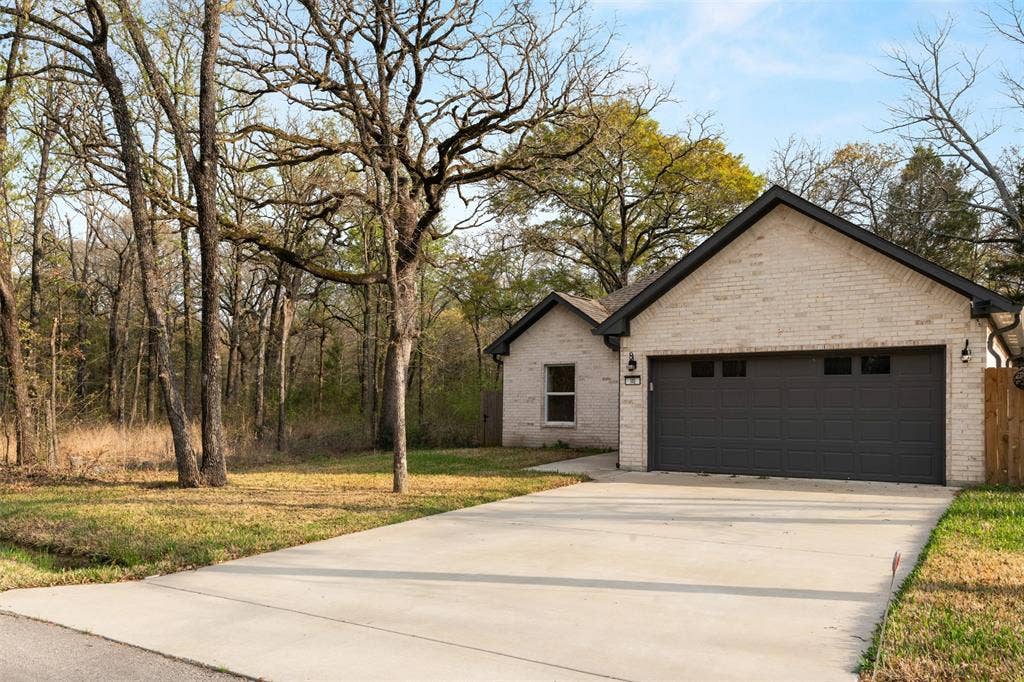 145 Barcelona Street, Payne Springs, TX 75156 Front of structure with 2 car garage