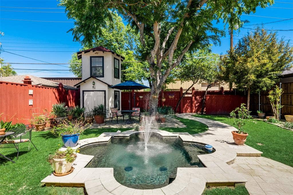 Back yard with small pool & storage facility (windmill)