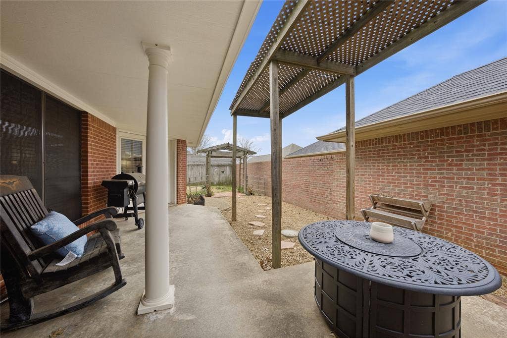 820 Torribrooke Lane, Athens, TX 75751 Fenced backyard featuring a patio area and grilling area