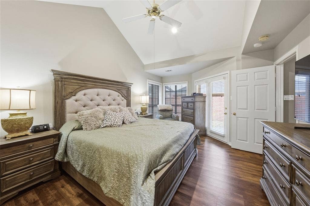 820 Torribrooke Lane, Athens, TX 75751 Bedroom with dark wood-style floors, vaulted ceiling, a ceiling fan, and access to exterior