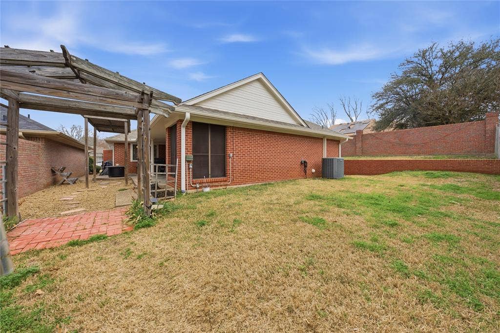 820 Torribrooke Lane, Athens, TX 75751 Rear view of house featuring a patio, a fenced backyard, and brick siding