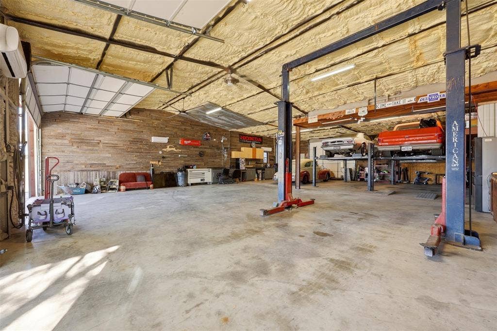 113 Mulkey Road, Waxahachie, TX 75167 Shopwith freestanding refrigerator, a wall mounted mini split, and a workshop area