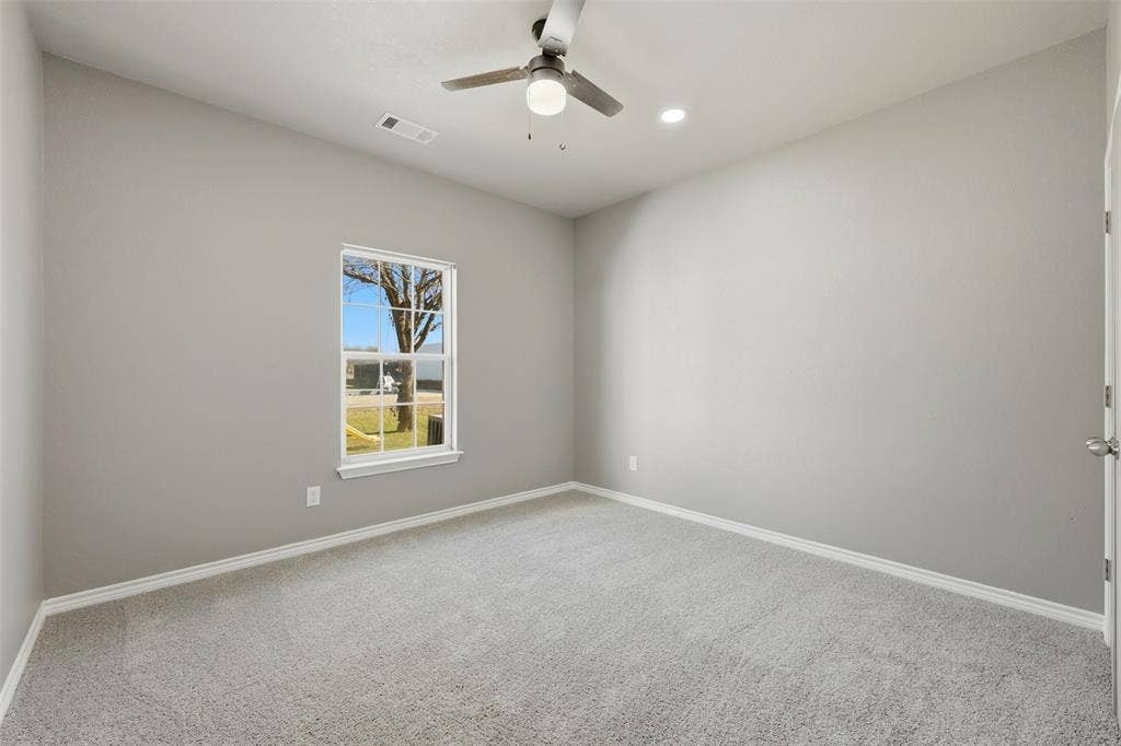 113 Mulkey Road, Waxahachie, TX 75167 room featuring light carpet, ceiling fan, and recessed lighting