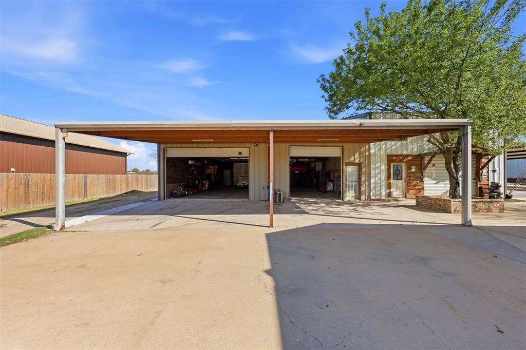 113 Mulkey Road, Waxahachie, TX 75167 View of parking featuring a detached shop