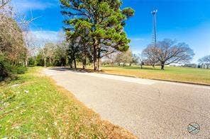 350 Frizzell Street, #7.20 Acres, Athens, TX 75751 View of asphalt street property on left
