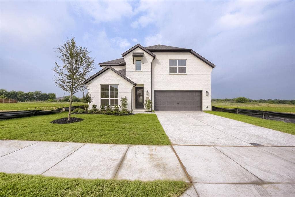 733 Red Cedar Road, Haslet, TX 76052 Contemporary two-story exterior featuring white brick and dark trim accents