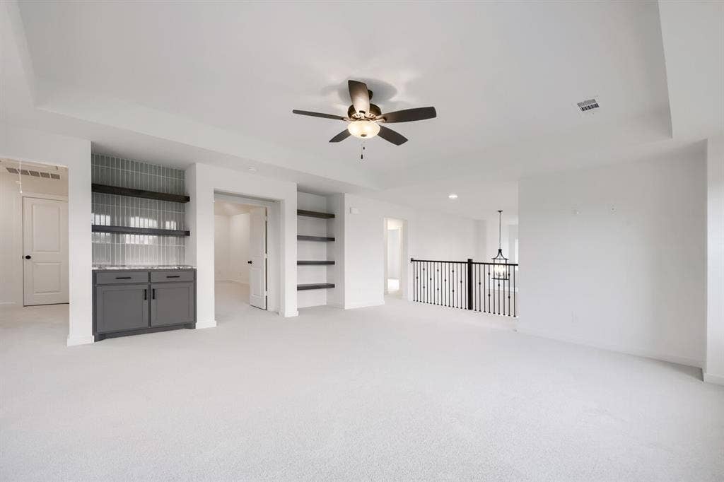 733 Red Cedar Road, Haslet, TX 76052 Spacious interior room featuring light-toned carpeting and a tray ceiling