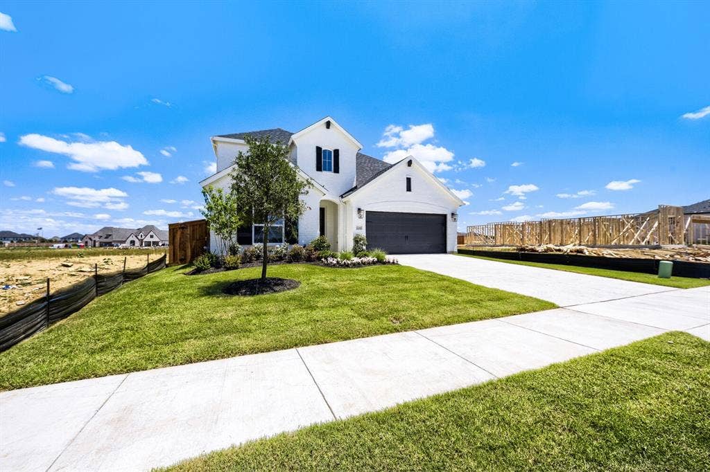 1241 Greenbriar Avenue, Haslet, TX 76052 Contemporary two-story exterior with white siding and a dark shingle roof