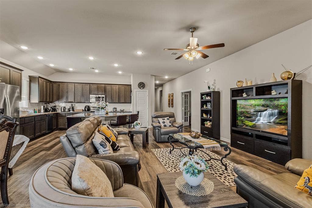 5408 Wedge Wood Drive, Haltom City, TX 76137 Living room with lofted ceiling, dark wood-style flooring, recessed lighting, and ceiling fan