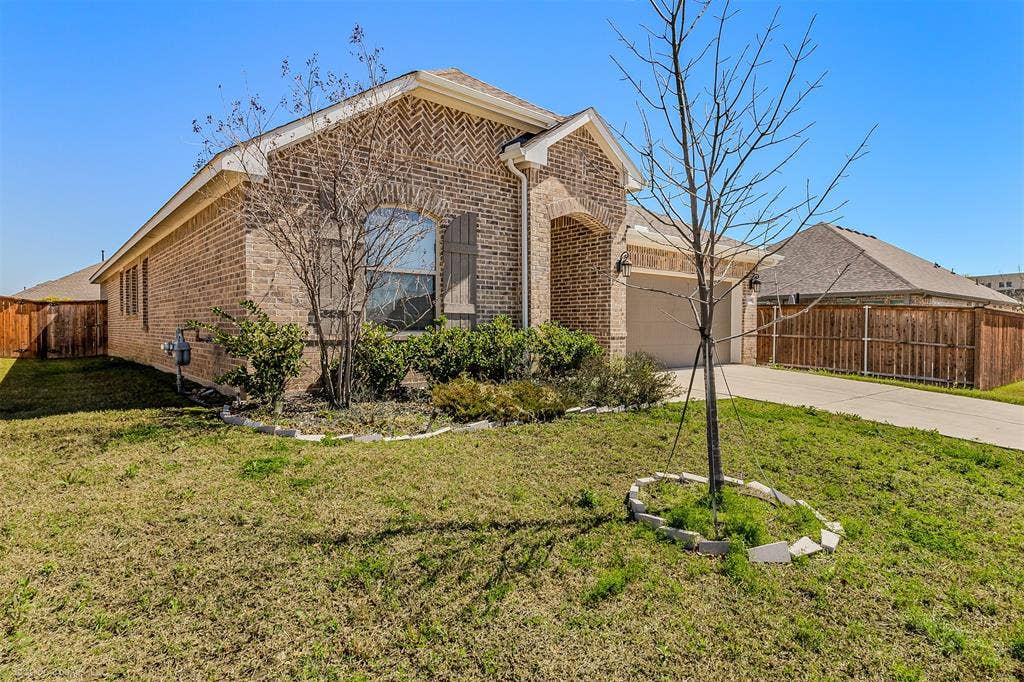5408 Wedge Wood Drive, Haltom City, TX 76137 View of front of property with brick siding, a garage, and driveway