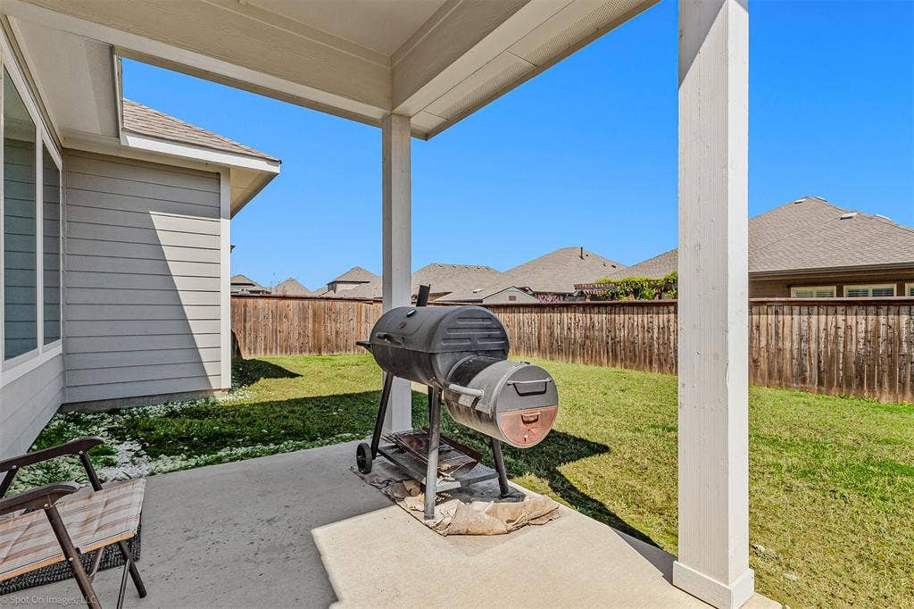 5408 Wedge Wood Drive, Haltom City, TX 76137 Fenced backyard with a patio area, area for grilling, and a residential view