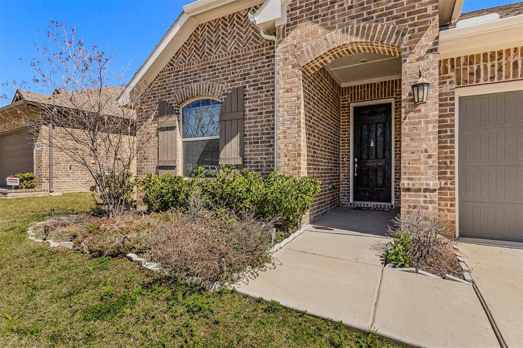 5408 Wedge Wood Drive, Haltom City, TX 76137 Entrance to property with brick siding and a garage