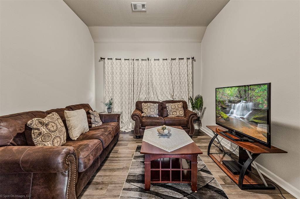 5408 Wedge Wood Drive, Haltom City, TX 76137 Second living area with wood finished floors and baseboards