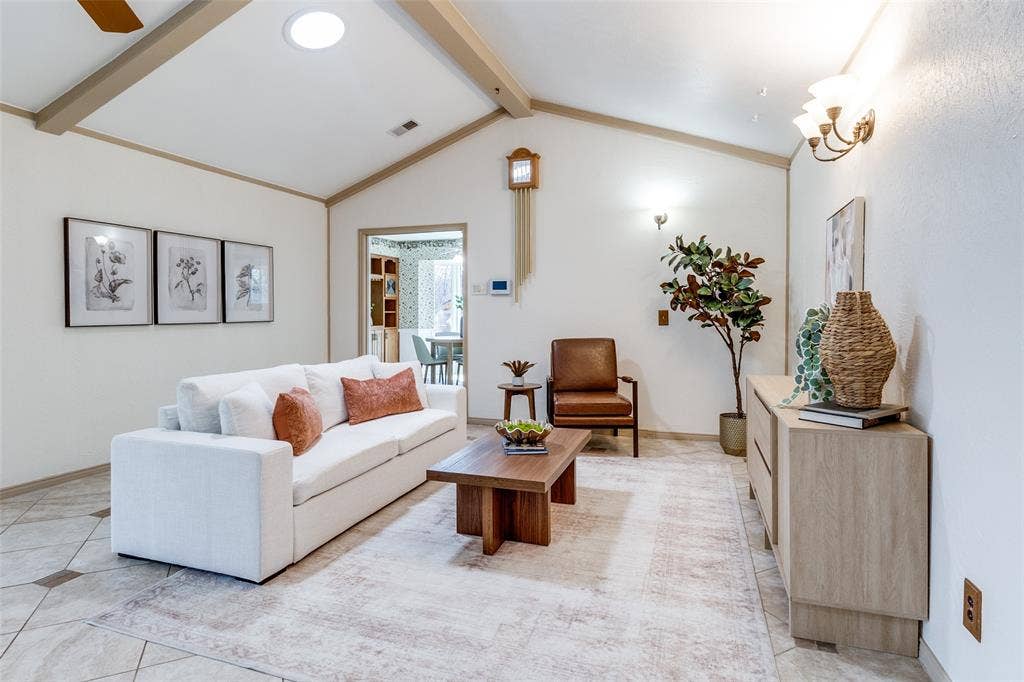 14810 Knollview Drive, Dallas, TX 75248 Living area featuring beam ceiling, light tile patterned flooring, and a ceiling fan