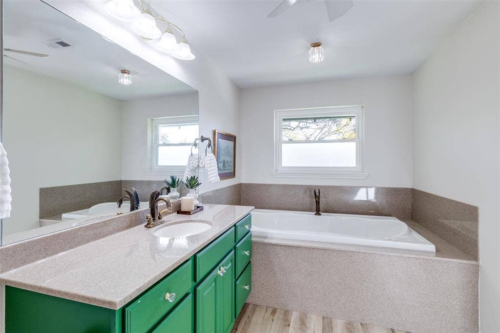 14810 Knollview Drive, Dallas, TX 75248 Bathroom featuring ceiling fan, a garden tub, vanity, light wood-type flooring, and plenty of natural light