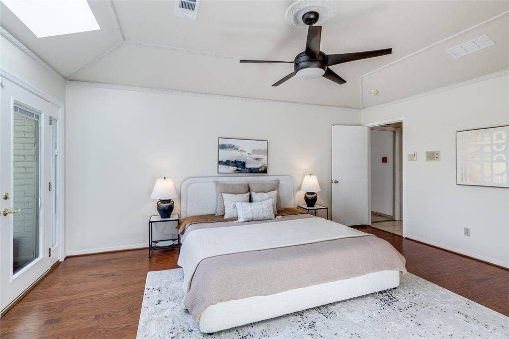 14810 Knollview Drive, Dallas, TX 75248 Bedroom featuring lofted ceiling, access to exterior, crown molding, ceiling fan, and dark wood finished floors