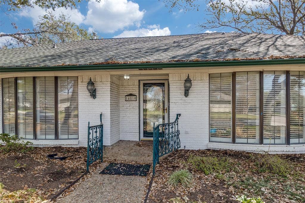 14810 Knollview Drive, Dallas, TX 75248 Entrance to property with brick siding and a shingled roof