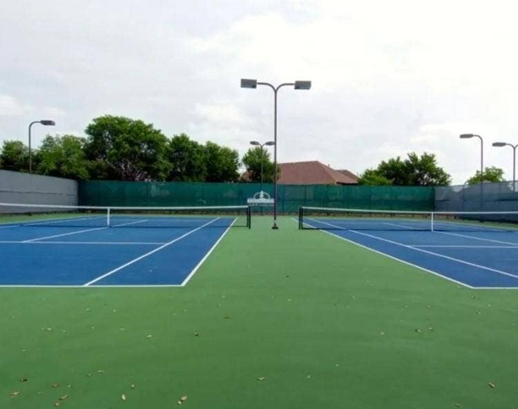 351 Southern Hills Drive, Fairview, TX 75069 Two tennis courts featuring blue and green surfacing