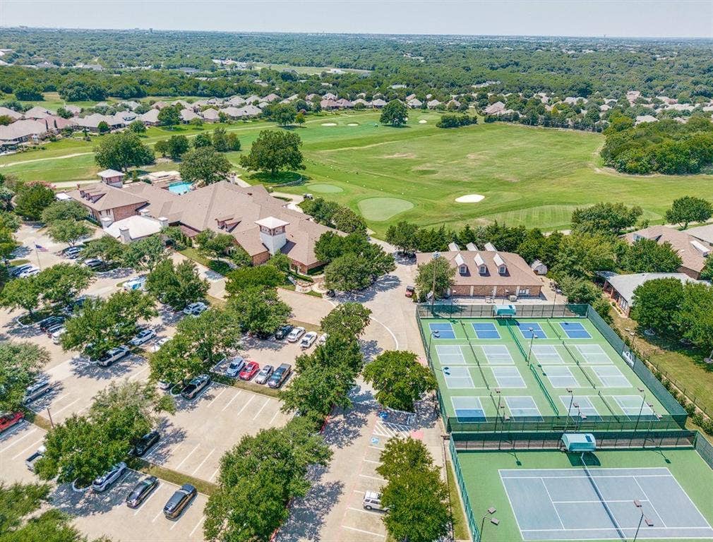 351 Southern Hills Drive, Fairview, TX 75069 Expansive grounds featuring a golf course, multiple tennis courts, a large clubhouse, and ample paved parking