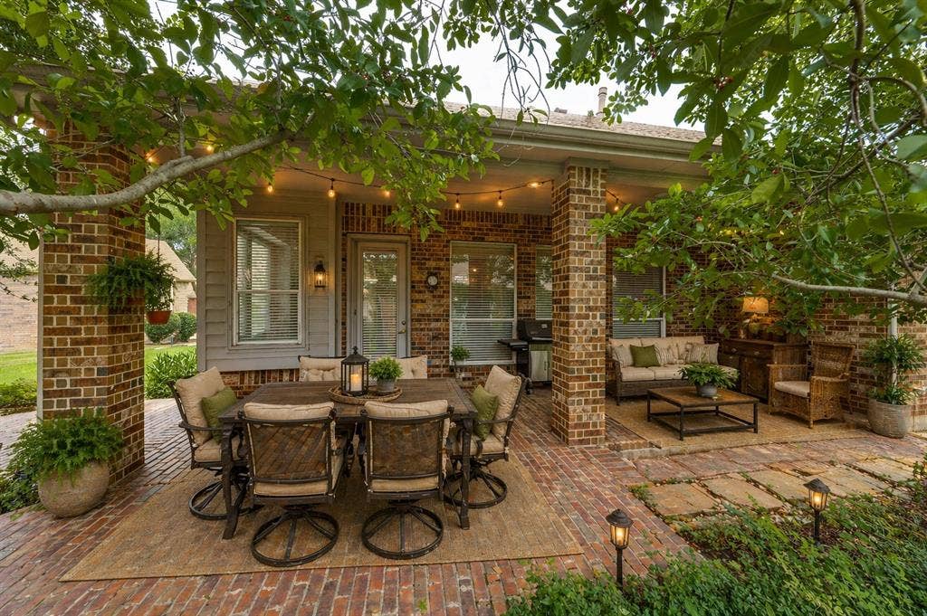 351 Southern Hills Drive, Fairview, TX 75069 Expansive brick patio featuring a covered dining area, brick columns - Virtually Staged