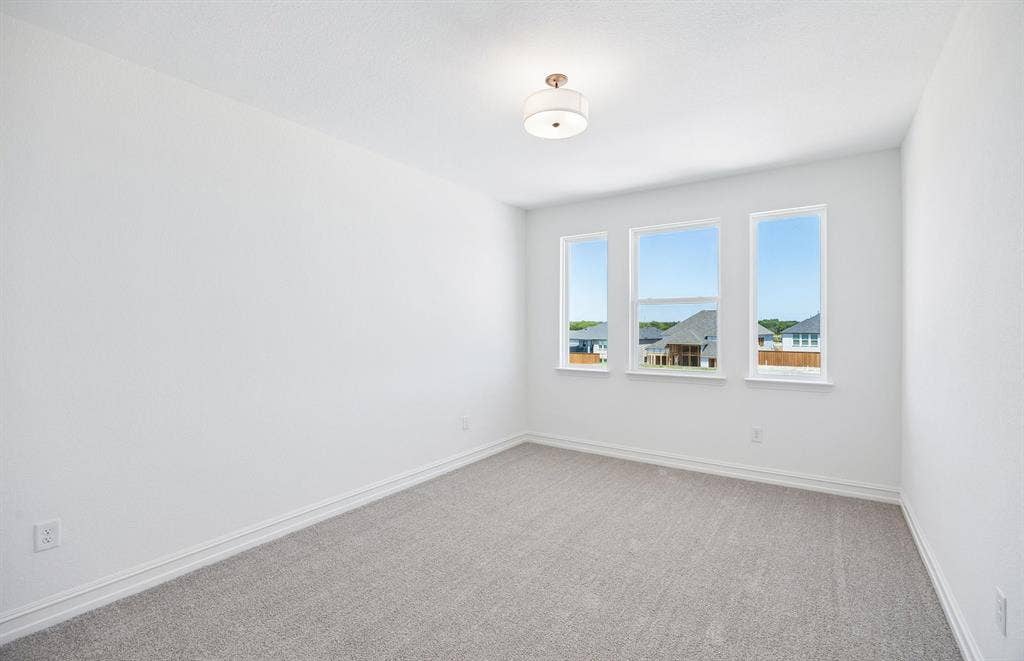 Secondary bedroom with large windows