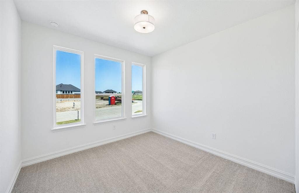 Secondary bedroom with large windows