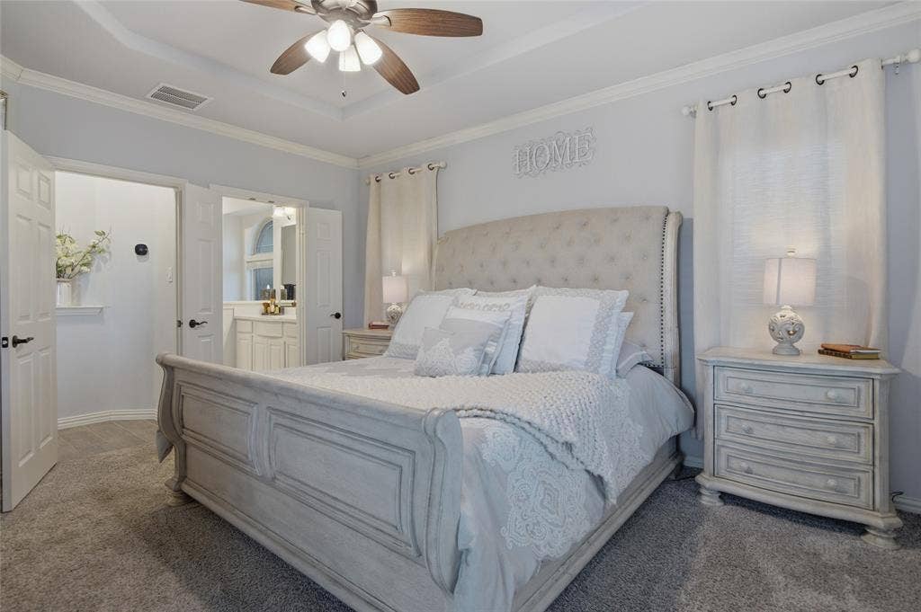 Master bedroom on first floor featuring ensuite bath