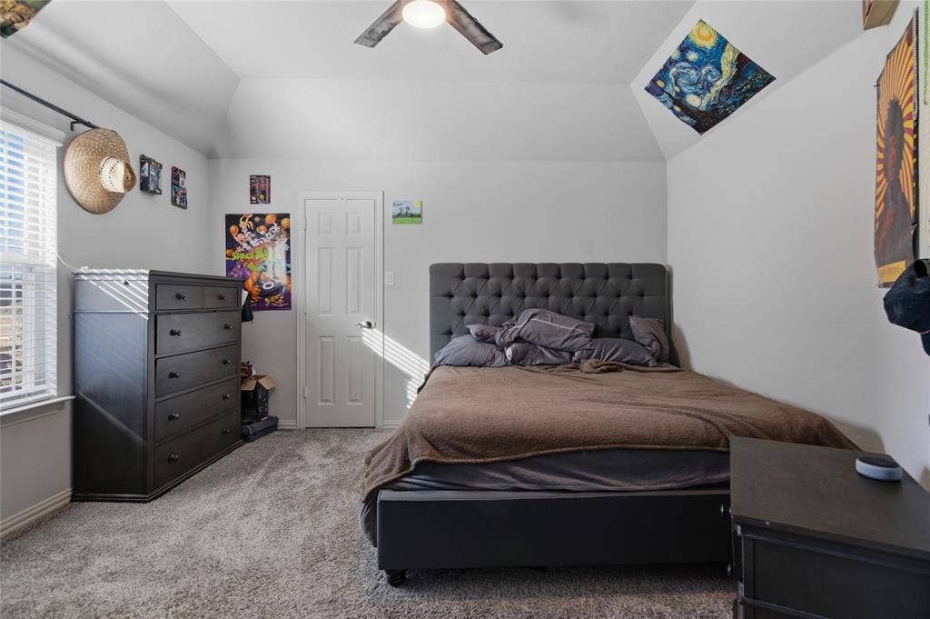 Bedroom #2 featuring a sloped ceiling with a visible ceiling fan and recessed lighting