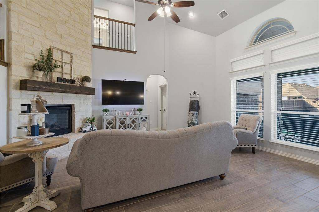 Living area with high ceilings and wood-finish flooring