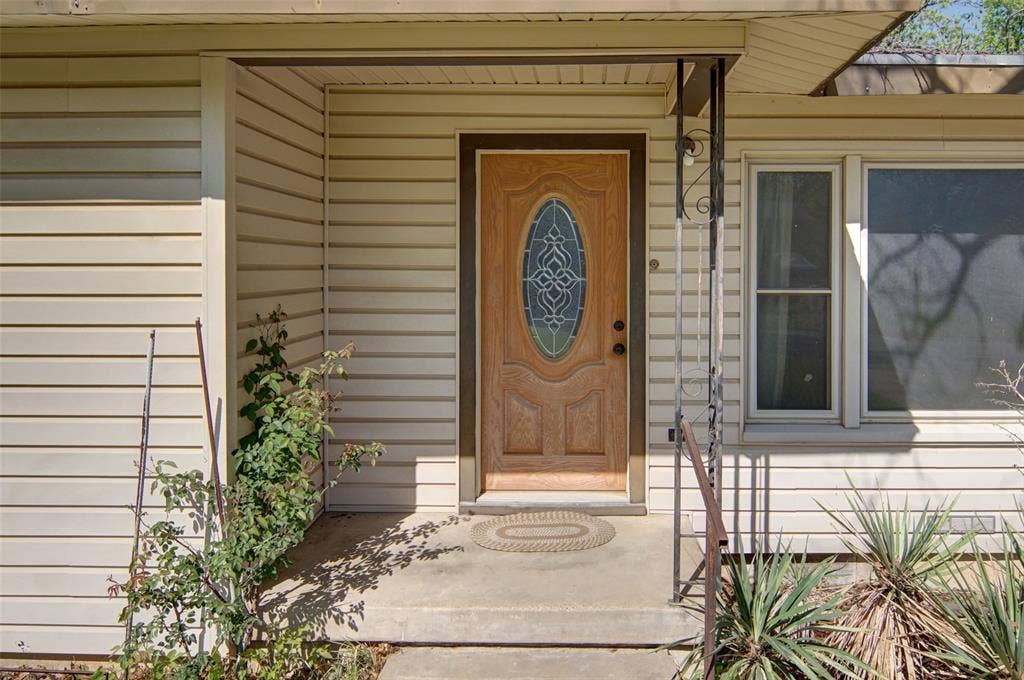 1224 S Brazos Street, Weatherford, TX 76086 Property entrance featuring a porch
