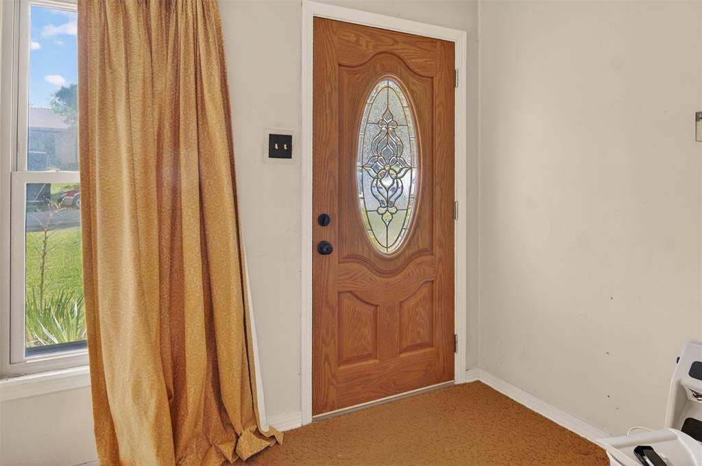 1224 S Brazos Street, Weatherford, TX 76086 Entrance featuring decorative front door.