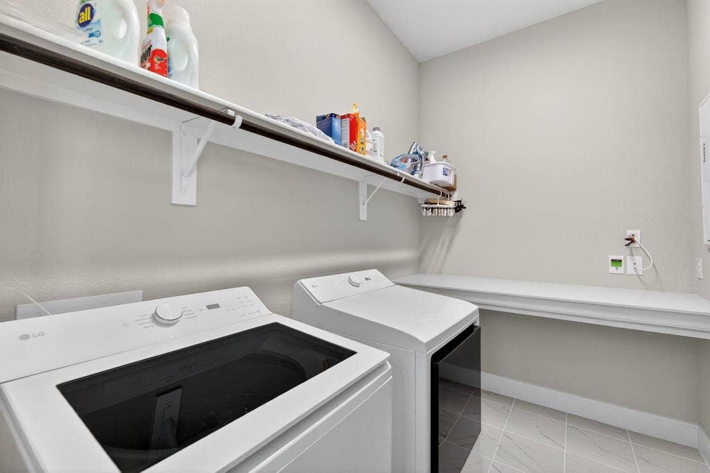 1414 Roundup Way, Argyle, TX 76226 Spacious laundry with table for folding & storage underneath