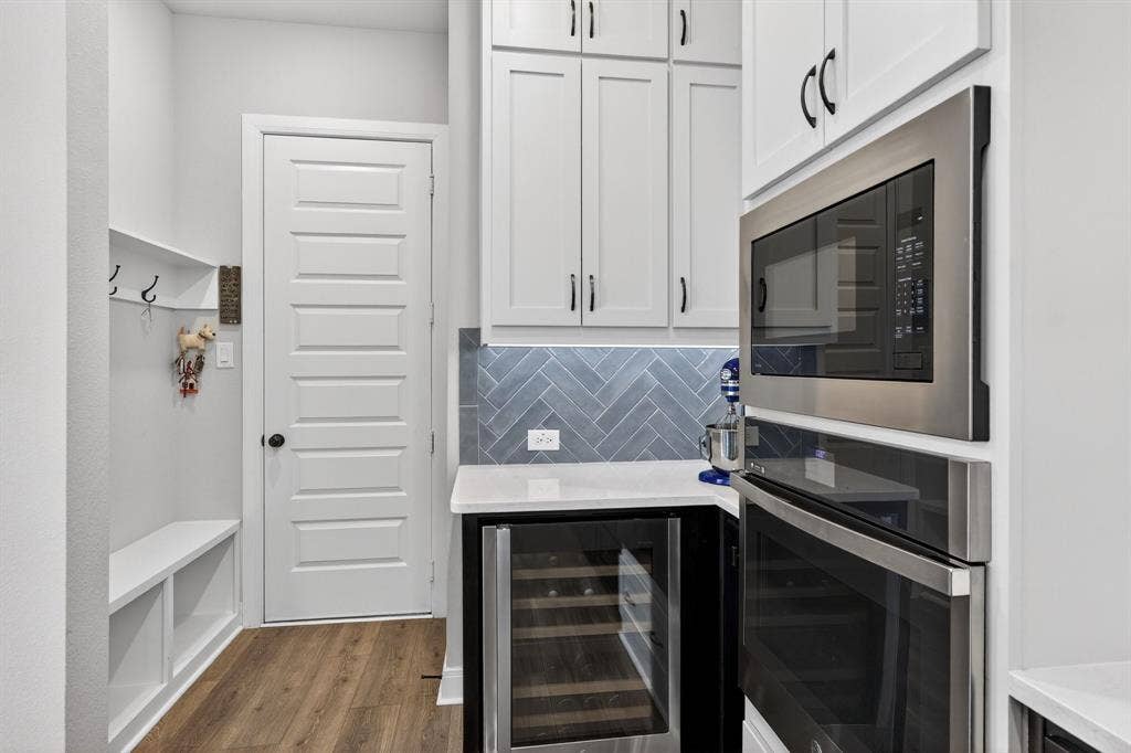 1414 Roundup Way, Argyle, TX 76226 Wine refrigerator & mud area off garage