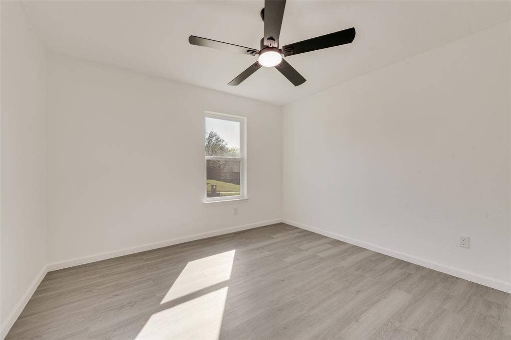 3217 Mahan Circle, Mesquite, TX 75149 Spare room featuring light wood-style floors and a ceiling fan