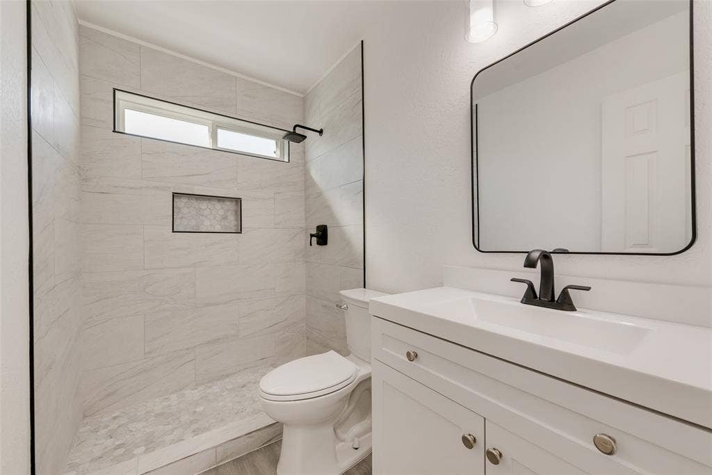 3217 Mahan Circle, Mesquite, TX 75149 Bathroom with vanity and a stall shower