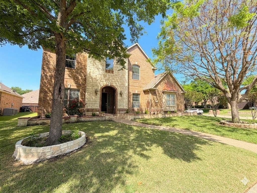 15031 Woodbluff Drive, Frisco, TX 75035 Brick and stone exterior with arched entryway